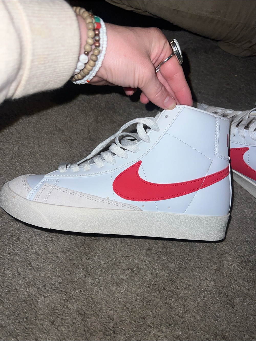 Nike White High-Top Sneakers with Red Swoosh